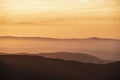 Lovely Winter landscape view from Red Screeds across misty layers of mountains towards the East Royalty Free Stock Photo