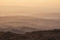 Lovely Winter landscape view from Red Screeds across misty layers of mountains towards the East Royalty Free Stock Photo