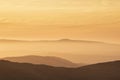 Lovely Winter landscape view from Red Screeds across misty layers of mountains towards the East Royalty Free Stock Photo