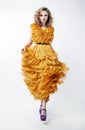 Lovely woman blonde fashion model in yellow dress