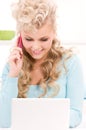 Lovely woman with cell phone and computer Royalty Free Stock Photo