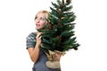 Lovely woman holding a christmastree Royalty Free Stock Photo