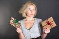 A lovely woman holding two gift boxes