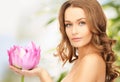 Lovely woman with lotos flower Royalty Free Stock Photo