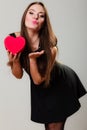 Lovely woman with red heart shaped gift box Royalty Free Stock Photo