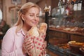 Lovely woman shopping for bread