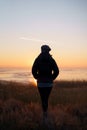 Lovely woman watching sunset in the nature Royalty Free Stock Photo