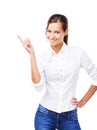 Lovely woman in white shirt pointing at copyspace Royalty Free Stock Photo