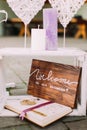 Lovely wooden album with the sign on the vintage crate decorated with candles.