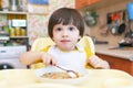 Lovely 2 years boy eating soup Royalty Free Stock Photo