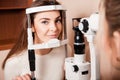 Lovely Young adult woman is having eye exam performed by eye doc Royalty Free Stock Photo