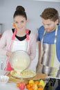 Lovely young couple baking cake Royalty Free Stock Photo
