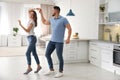 Lovely young couple dancing in kitchen Royalty Free Stock Photo