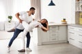 Lovely young couple dancing in kitchen Royalty Free Stock Photo