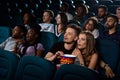 Lovely young couple on a date at the cinema Royalty Free Stock Photo
