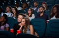 Lovely young couple on a date at the cinema Royalty Free Stock Photo
