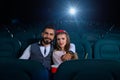 Lovely young couple on a date at the cinema Royalty Free Stock Photo