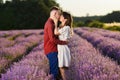 Young couple in a lavender field at sunset Royalty Free Stock Photo