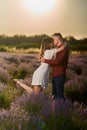 Young couple in a lavender field at sunset Royalty Free Stock Photo