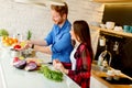 Young couple preparing healthy meal in the kitchen Royalty Free Stock Photo