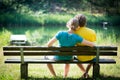 Lovely young couple sitting on bench Royalty Free Stock Photo