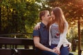 Lovely young couple sitting on a seat bench Royalty Free Stock Photo