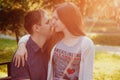 Lovely young couple sitting on a seat bench Royalty Free Stock Photo