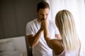 Lovely young couple standing by the window Royalty Free Stock Photo