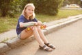 Cute young girl with pennyboard outdoors Royalty Free Stock Photo