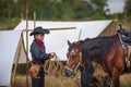 A lovely young lady Cowgirl standing on a ranch with her horse Happy woman cowgirl caring for her horse on the farm Royalty Free Stock Photo