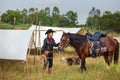 A lovely young lady Cowgirl standing on a ranch with her horse Happy woman cowgirl caring for her horse on the farm Royalty Free Stock Photo