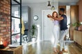 Lovely young multiethnic couple dance in living room Royalty Free Stock Photo