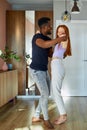 Lovely young multiethnic couple dance in living room Royalty Free Stock Photo