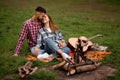 Lovely young smiling man and woman relaxing in the park. Love story. Royalty Free Stock Photo