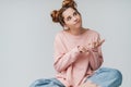 Lovely young teenage girl sitting with legs crossed Royalty Free Stock Photo