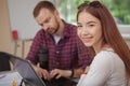 Lovely young teenage girl working on a project with her teacher