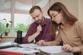 Lovely young teenage girl working on a project with her teacher Royalty Free Stock Photo