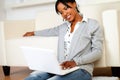 Lovely young woman smiling and looking to laptop Royalty Free Stock Photo