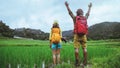Lover asian men asian women travel nature Travel relax Walking a photo on the rice field in rainy season in Chiang Mai, Thailand Royalty Free Stock Photo