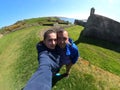 Lover couple take selfie on Charles Fort background. Kinsale. Ireland. Royalty Free Stock Photo