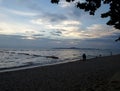 Lover walk on romantic long quiet beach under beautiful sky Royalty Free Stock Photo