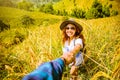 Lover women and men asians travel relax in the holiday. Hold hands running on the lawn Rice fields Golden yellow. Wild nature wood Royalty Free Stock Photo