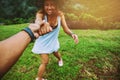 Lover women and men asians travel relax in the holiday. Hold hands running on the lawn. Wild nature wood on the mountain Royalty Free Stock Photo