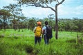 Lover woman and men Asian travel nature. Travel relax. Photography Cucumber sessilis flower field Royalty Free Stock Photo