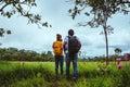 Lover woman and men Asian travel nature. Travel relax. Photography Cucumber sessilis flower field Royalty Free Stock Photo