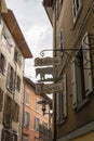 Lovere, Italy - June 28, 2017: Narrow street with houses with tiled roofs in an Italian town.