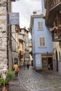 Lovere, Italy - June 28, 2017: Narrow street with houses with tiled roofs in an Italian town