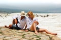 Lovers against the backdrop of white cliffs. Turkey. Pamukkale