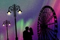 Lovers in amusement park at night Royalty Free Stock Photo