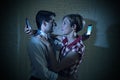 Lovers couple of internet and mobile phone addict ignoring each other Royalty Free Stock Photo